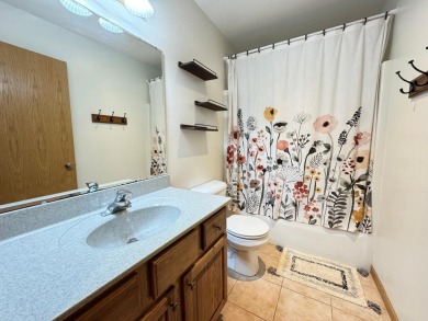 Tucked back on a nicely wooded lot, this TIMBER RIDGE home on Timber Ridge Golf Club in Wisconsin - for sale on GolfHomes.com, golf home, golf lot