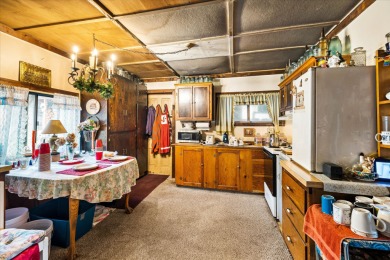 You will love this beautiful rustic cabin built in 1920 on .163 on Meadow Creek Golf Course in Montana - for sale on GolfHomes.com, golf home, golf lot