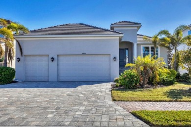 Welcome to a St Thomas lake-view model in the famous Legends Bay on IMG Academies Golf and Country Club in Florida - for sale on GolfHomes.com, golf home, golf lot