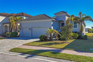 Welcome to a St Thomas lake-view model in the famous Legends Bay on IMG Academies Golf and Country Club in Florida - for sale on GolfHomes.com, golf home, golf lot