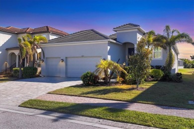 Welcome to a St Thomas lake-view model in the famous Legends Bay on IMG Academies Golf and Country Club in Florida - for sale on GolfHomes.com, golf home, golf lot