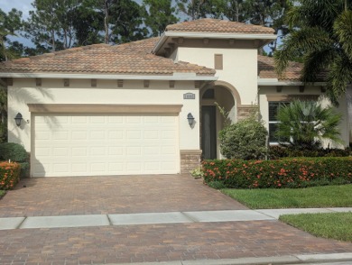 This sought-after Lago plan offers an exceptional open-concept on PGA Golf Club in PGA Village in Florida - for sale on GolfHomes.com, golf home, golf lot