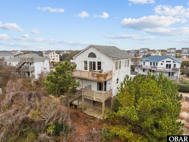 Welcome to 577 Trolling Lane, a charming coastal retreat located on The Currituck Golf Club in North Carolina - for sale on GolfHomes.com, golf home, golf lot