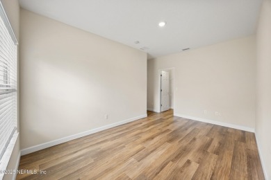 Beautiful Palm Coast Home! Spacious 3 bed, 2 bath home with 2 on The Grand Club - Pine Lakes Course in Florida - for sale on GolfHomes.com, golf home, golf lot