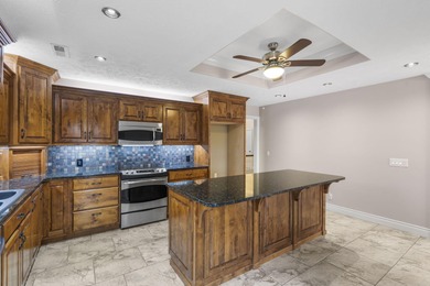 Welcome to 115 Ironwood, a beautifully maintained 5-bedroom, 3 on Island Green Golf Club in Missouri - for sale on GolfHomes.com, golf home, golf lot