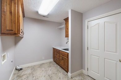 Welcome to 115 Ironwood, a beautifully maintained 5-bedroom, 3 on Island Green Golf Club in Missouri - for sale on GolfHomes.com, golf home, golf lot