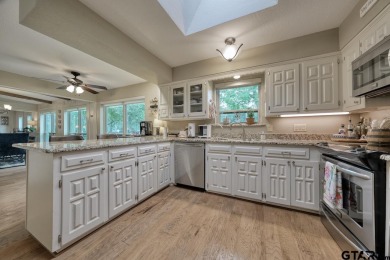 Nestled directly on the scenic Golf Course in Hideaway, this on Hide-A-Way Lake Golf Course in Texas - for sale on GolfHomes.com, golf home, golf lot
