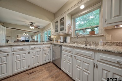 Nestled directly on the scenic Golf Course in Hideaway, this on Hide-A-Way Lake Golf Course in Texas - for sale on GolfHomes.com, golf home, golf lot