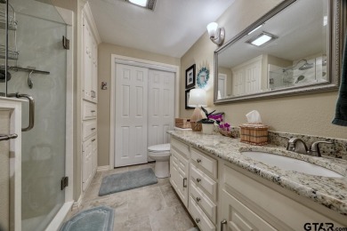 Nestled directly on the scenic Golf Course in Hideaway, this on Hide-A-Way Lake Golf Course in Texas - for sale on GolfHomes.com, golf home, golf lot