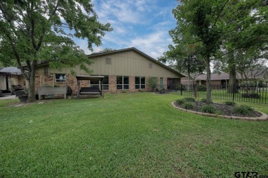 Nestled directly on the scenic Golf Course in Hideaway, this on Hide-A-Way Lake Golf Course in Texas - for sale on GolfHomes.com, golf home, golf lot