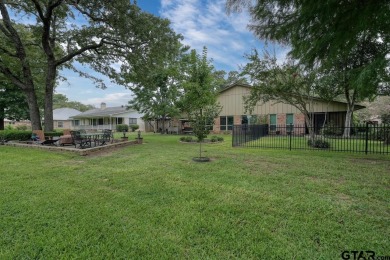 Nestled directly on the scenic Golf Course in Hideaway, this on Hide-A-Way Lake Golf Course in Texas - for sale on GolfHomes.com, golf home, golf lot