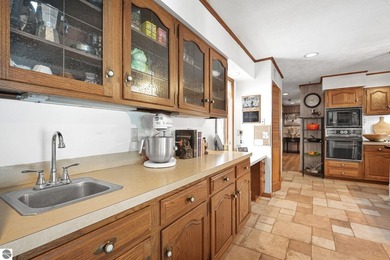 Positioned on corner parcel, this home blends comfort & casual on  in Michigan - for sale on GolfHomes.com, golf home, golf lot