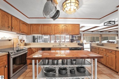 Positioned on corner parcel, this home blends comfort & casual on  in Michigan - for sale on GolfHomes.com, golf home, golf lot