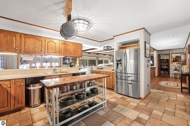 Positioned on corner parcel, this home blends comfort & casual on  in Michigan - for sale on GolfHomes.com, golf home, golf lot