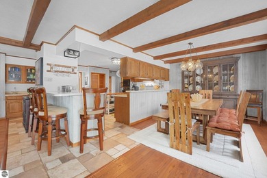 Positioned on corner parcel, this home blends comfort & casual on  in Michigan - for sale on GolfHomes.com, golf home, golf lot