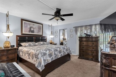 UPDATED & MOVE-IN READY! Turnkey in Portofino at Wynmoor with on Wynmoor Golf Course in Florida - for sale on GolfHomes.com, golf home, golf lot