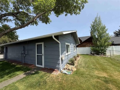 Welcome to this well-maintained 4-bedroom, 2-bath home ideally on Olive Glenn Golf and Country Club in Wyoming - for sale on GolfHomes.com, golf home, golf lot