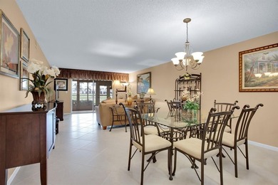 Discover unparalleled elegance and functionality in this on Wynmoor Golf Course in Florida - for sale on GolfHomes.com, golf home, golf lot