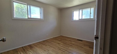 Located just two blocks from Hot Springs State Park and the on Legion Town And Country Club in Wyoming - for sale on GolfHomes.com, golf home, golf lot