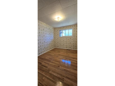 Located just two blocks from Hot Springs State Park and the on Legion Town And Country Club in Wyoming - for sale on GolfHomes.com, golf home, golf lot