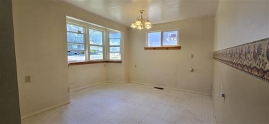 Located just two blocks from Hot Springs State Park and the on Legion Town And Country Club in Wyoming - for sale on GolfHomes.com, golf home, golf lot