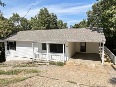 This well maintained home on 2 lots, has just been remodeled on Cherokee Village North Course in Arkansas - for sale on GolfHomes.com, golf home, golf lot