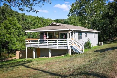 Welcome to this charming remodeled cottage style home featuring on Holiday Island Executive Golf Course in Arkansas - for sale on GolfHomes.com, golf home, golf lot