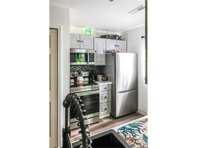 Welcome to this charming remodeled cottage style home featuring on Holiday Island Executive Golf Course in Arkansas - for sale on GolfHomes.com, golf home, golf lot