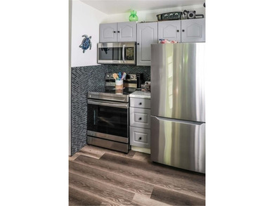 Welcome to this charming remodeled cottage style home featuring on Holiday Island Executive Golf Course in Arkansas - for sale on GolfHomes.com, golf home, golf lot