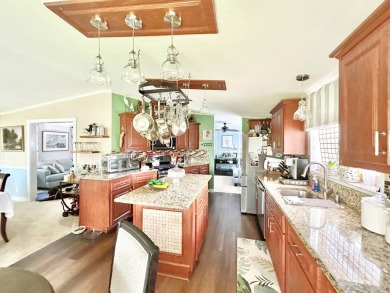 This lovely 3-bedroom, 2-bathroom manufactured home is located on Crane Lakes Golf and Country Club in Florida - for sale on GolfHomes.com, golf home, golf lot