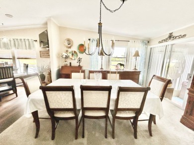 This lovely 3-bedroom, 2-bathroom manufactured home is located on Crane Lakes Golf and Country Club in Florida - for sale on GolfHomes.com, golf home, golf lot