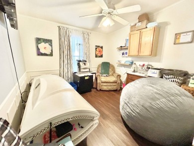 This lovely 3-bedroom, 2-bathroom manufactured home is located on Crane Lakes Golf and Country Club in Florida - for sale on GolfHomes.com, golf home, golf lot