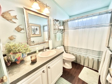 This lovely 3-bedroom, 2-bathroom manufactured home is located on Crane Lakes Golf and Country Club in Florida - for sale on GolfHomes.com, golf home, golf lot