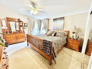 This lovely 3-bedroom, 2-bathroom manufactured home is located on Crane Lakes Golf and Country Club in Florida - for sale on GolfHomes.com, golf home, golf lot