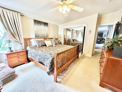 This lovely 3-bedroom, 2-bathroom manufactured home is located on Crane Lakes Golf and Country Club in Florida - for sale on GolfHomes.com, golf home, golf lot