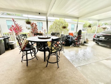 This lovely 3-bedroom, 2-bathroom manufactured home is located on Crane Lakes Golf and Country Club in Florida - for sale on GolfHomes.com, golf home, golf lot