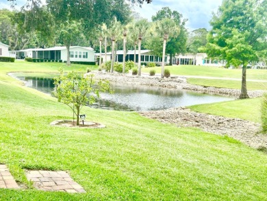This lovely 3-bedroom, 2-bathroom manufactured home is located on Crane Lakes Golf and Country Club in Florida - for sale on GolfHomes.com, golf home, golf lot