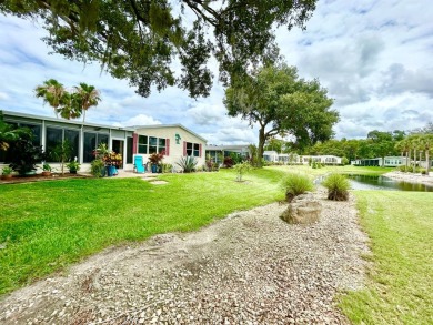 This lovely 3-bedroom, 2-bathroom manufactured home is located on Crane Lakes Golf and Country Club in Florida - for sale on GolfHomes.com, golf home, golf lot