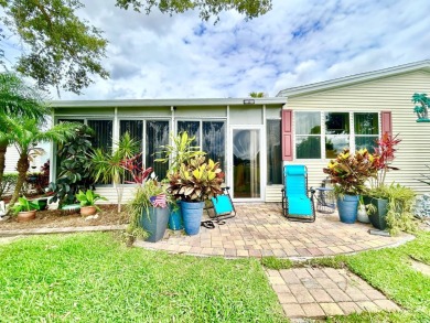 This lovely 3-bedroom, 2-bathroom manufactured home is located on Crane Lakes Golf and Country Club in Florida - for sale on GolfHomes.com, golf home, golf lot