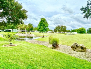 This lovely 3-bedroom, 2-bathroom manufactured home is located on Crane Lakes Golf and Country Club in Florida - for sale on GolfHomes.com, golf home, golf lot