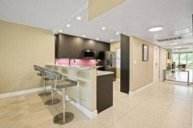 This fully renovated 3/2, 1st flr home offers the perfect blend on Palm-Aire Country Club and Resort - Palms in Florida - for sale on GolfHomes.com, golf home, golf lot