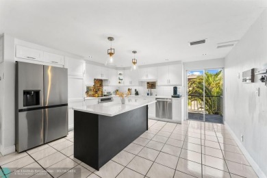 Discover refined living in the energy-efficient home, nestled on Country Club of Miami in Florida - for sale on GolfHomes.com, golf home, golf lot