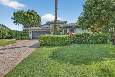 A beautiful Courtyard entrance and amazing 5 acre lake/golf on  in Florida - for sale on GolfHomes.com, golf home, golf lot