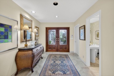 A beautiful Courtyard entrance and amazing 5 acre lake/golf on  in Florida - for sale on GolfHomes.com, golf home, golf lot
