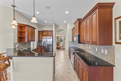 Perfectly positioned along the golf course, this elegant pool on Venetian Golf and River Club in Florida - for sale on GolfHomes.com, golf home, golf lot