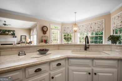 Tucked into a quiet cul-de-sac in sought-after Windward, this on The Golf Club of Georgia in Georgia - for sale on GolfHomes.com, golf home, golf lot