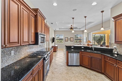 Perfectly positioned along the golf course, this elegant pool on Venetian Golf and River Club in Florida - for sale on GolfHomes.com, golf home, golf lot