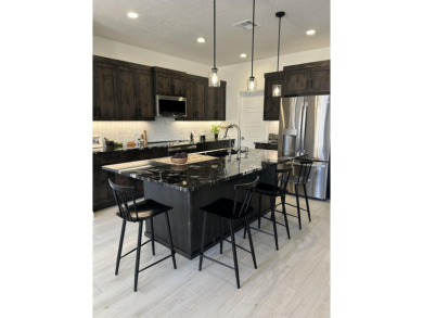 1325 Pocket Mesa Dr - Modern Desert Living at The Ledges. This on The Ledges Golf Club in Utah - for sale on GolfHomes.com, golf home, golf lot