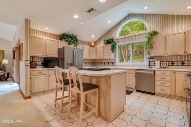 Set on 1.46 acres in Tanglwood Lakes, this 3,310-SF PRIVATE on Paupack Hills Golf and Country Club in Pennsylvania - for sale on GolfHomes.com, golf home, golf lot