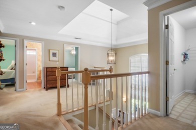 Tucked into a quiet cul-de-sac in sought-after Windward, this on The Golf Club of Georgia in Georgia - for sale on GolfHomes.com, golf home, golf lot